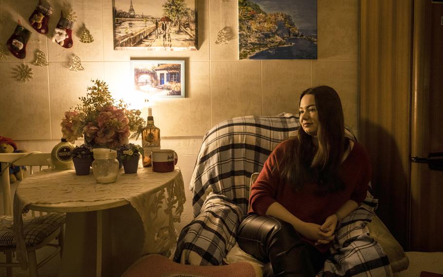 Mia Willard, 24, a Ukrainian American student, drinks tea in her apartment on Kyiv’s left bank.