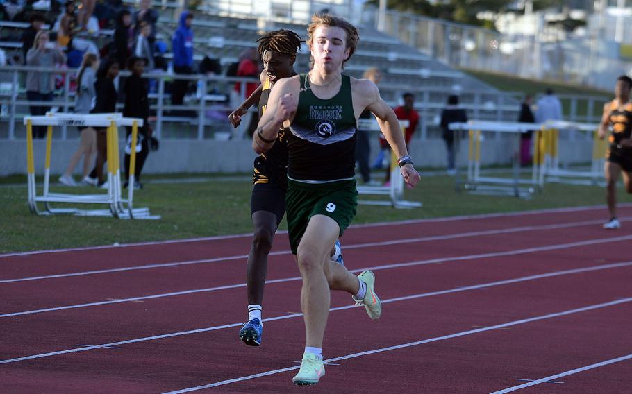 Kubasaki's Caleb Stephan and Kadena's Jayden Allen race for home in the 400 during Thursday's Day 2 of the two-day Okinawa track and field meet. Stephan won in 53.92 seconds.