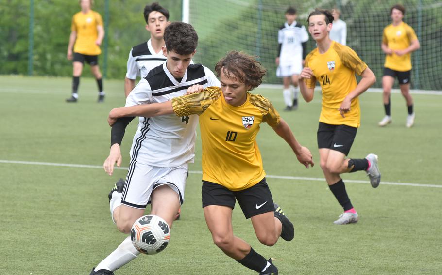 SHAPE's Jose Labella and Stuttgart's Ryan Stevenson battle for the ball Wednesday, May 17, 2023, in the semifinals of the DODEA-Europe Division I soccer semifinals at Reichenbach-Steegen, Germany.