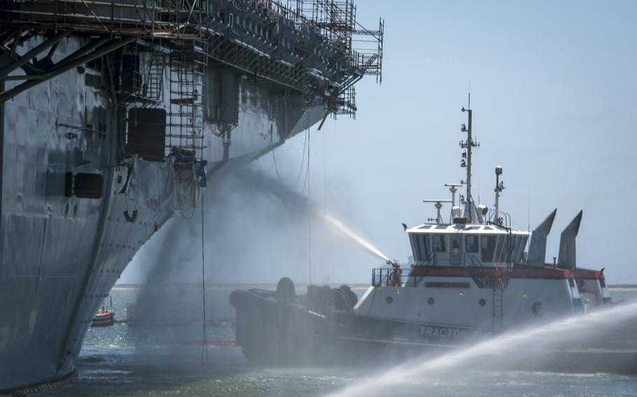 Firefighters combat a blaze aboard the USS Bonhomme Richard at Naval Base San Diego, July 14, 2020.