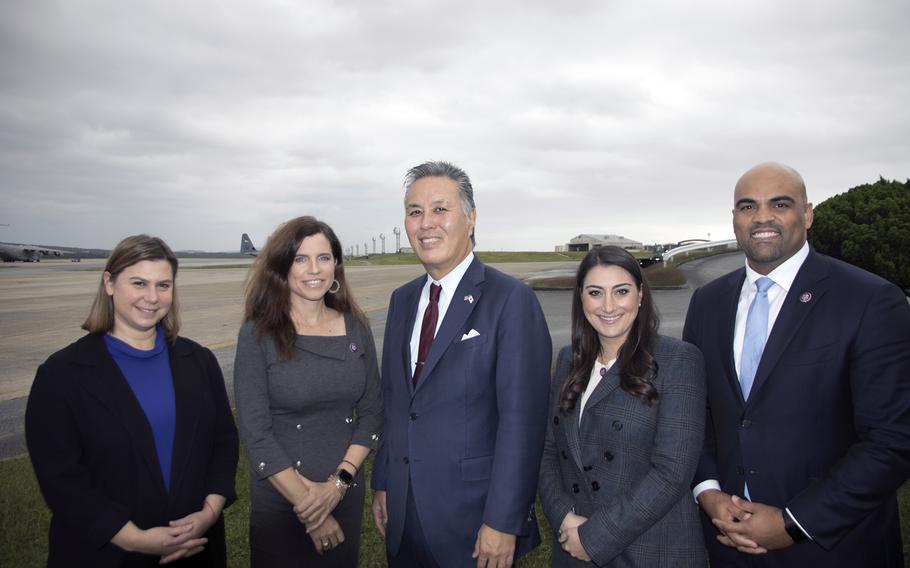 U.S. Reps. Elissa Slotkin, D-Mich.; Nancy Mace, R-S.C.; Mark Takano, D-Calif.; Sara Jacobs, D-Calif; and Colin Allred, D-Texas, pose at Kadena Air Base, Okinawa, Tuesday, Nov. 23, 2021. 