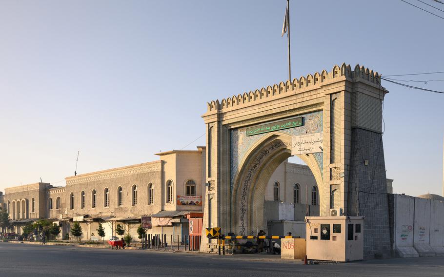 Taliban soldiers guard the entrance to government officials’ offices in Kandahar.