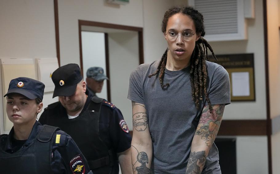 WNBA star and two-time Olympic gold medalist Brittney Griner is escorted from a courtroom after a hearing in Khimki just outside Moscow, Russia, on Aug. 4, 2022. 