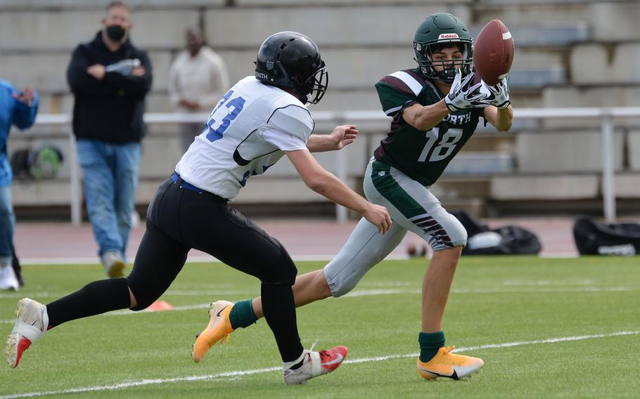 AFNORTH’s Nathan Goldsmith attempts to pull in a pass against Hunter Maples of Hohenfels in a Division III game played at Kaiserslautern High School, Saturday, Sept. 11, 2021. AFNORTH won the game that was ended in the final minutes of the third quarter, 76-28.