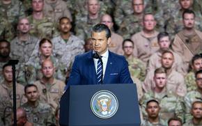 Defense Secretary Pete Hegseth addresses troops during President Donald Trump’s visit to Al Udeid Air Base, Qatar, May 15, 2025. The following day in the United Arab Emirates, Hegseth and his UAE counterpart, Mohammed Mubarak Al Mazrouei, signed a letter of intent to establish a major defense partnership between the two countries.