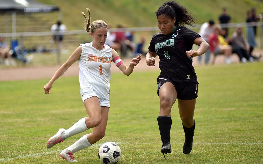 Spangdahlem forward Alexis Lauer tries to center a pass into the box against AFNORTH defender Koren Russel during the second day of round-robin action at the 2025 Division III DODEA European championships on May 20, 2025, at Rothenborn Stadion in Landstuhl, Germany.