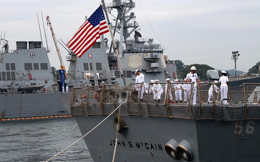 The USS John S. McCain departs Yokosuka Naval Base, Japan, Friday, Sept. 17, 2021. The guided-missile destroyer is shifting its homeport to Naval Station Everett, Wash., after 24 years in the Far East. 