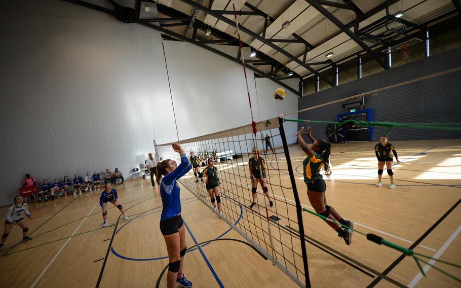 Nyla Williamson of SHAPE sends the ball over the net as Wiesbaden’s Lyndsey Urick stands ready to block during the 2022 DODEA-Europe Volleyball Tournament, Thursday, Oct. 27, 2022, at Ramstein Air Base, Germany.