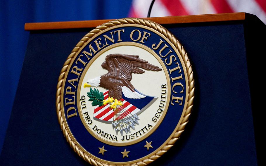 The seal of the Justice Department on a lectern in the department's headquarters briefing room in 2023.