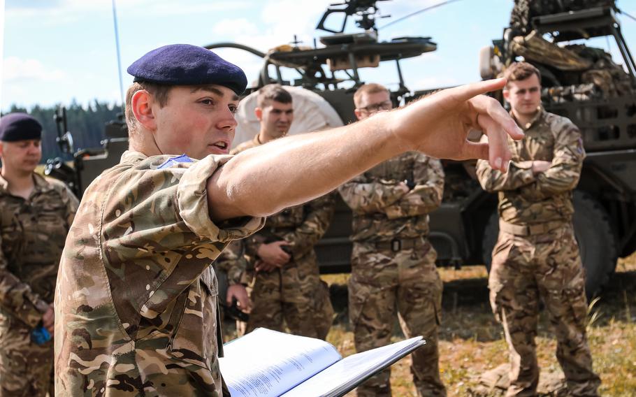 British army 1st Lt. Hugo Chaplin gives a safety brief to his soldiers before they start a weapons training event with the Battle Group Poland at Bemowo Piskie Training Area, Poland, in 2018. The U.K. and Estonia have sent troops to Poland to help the country deal with a migrant crisis on its border. 
