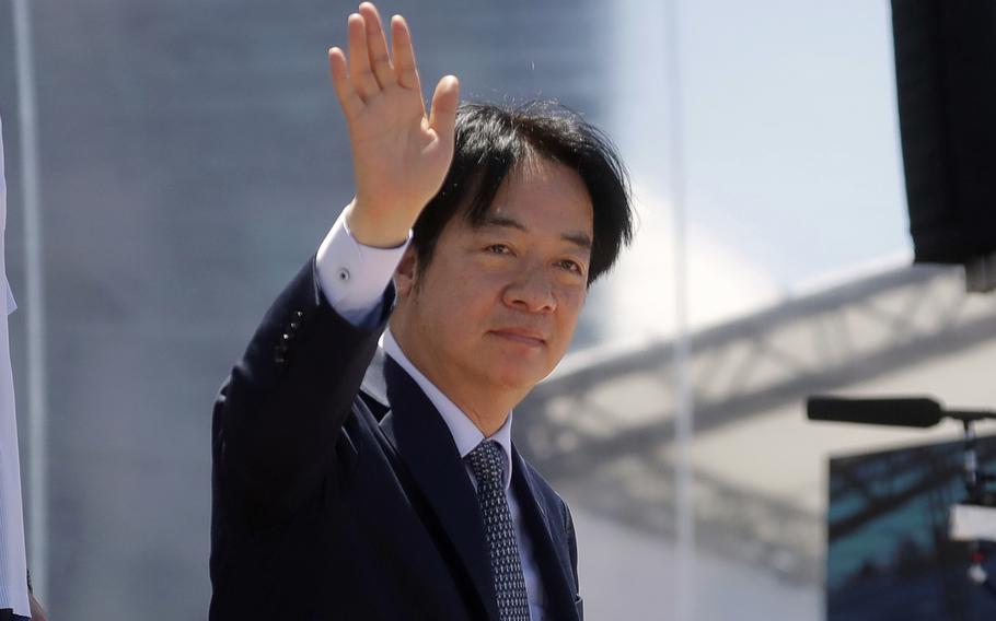Taiwan’s president waves.