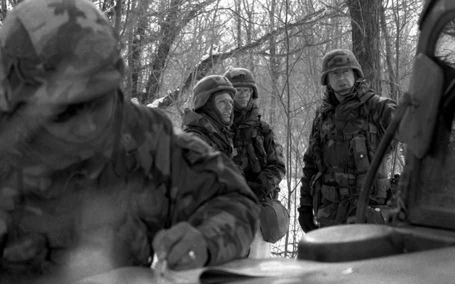 Maj. Gen. Peter J. Boylan Jr., right, commanding general, 10th Mountain Division (Light Infantry), visits a unit of the division in the field, Oct. 1, 1988.