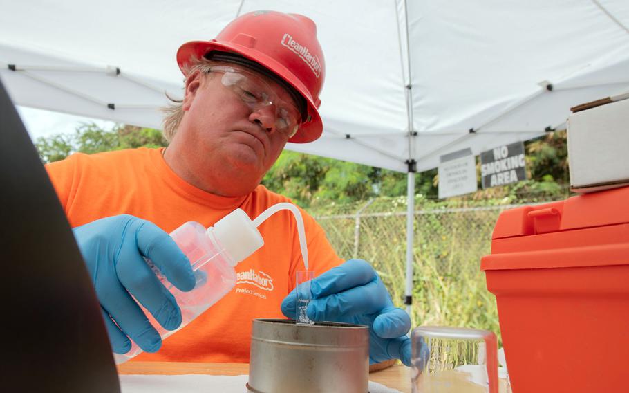 A Navy contractor tests a Red Hill well water sample for total petroleum hydrocarbons, or TPH, March 8, 2022.