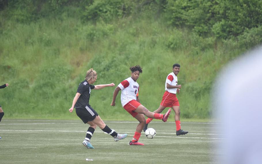 Vicenza's Nicolas Morton and Aviano's Terrance Johnson are brief dance partners in the Cougars' 4-0 victory over the Saints on Monday, May 15, 2023, in the first round of the DODEA-Europe Division II soccer championships in Baumholder, Germany.