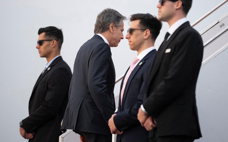 US Secretary of State Antony Blinken (center) boards his plane at Yokota Air Base in Fussa, Tokyo prefecture on April 18, 2023. 