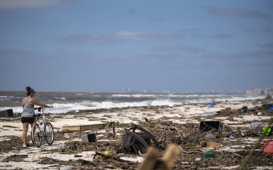 Debris from storm damage covers the beach after Hurricane Ian ravaged Bonita Springs, Fla., in September 2022. 