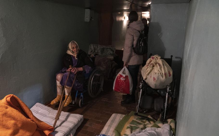 A patient waits in a hospital basement-turned-shelter in Mykolaiv, Ukraine, where hospitals are being attacked. 