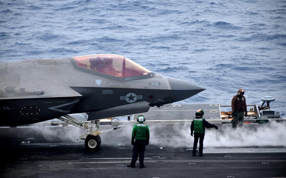 An F-35C Lightning II stealth fighter prepares to take off from the aircraft carrier USS Abraham Lincoln in the Philippine Sea, Saturday, April 23, 2022.