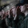 Aboard the USS Kitty Hawk, Apr. 10, 2003: Sailors salute during a memorial service for a former Carrier Air Wing 5 member Thursday on the USS Kitty Hawk.

META TAGS: Wars on Terror; U.S. Navy; USS Kitty Hawk; memorial; 