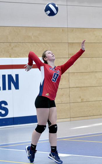 Aviano junior Mayci Salmon serves during a Division II semifinal against Black Forest Academy at the DODEA European volleyball championships Friday at Ramstein High School on Ramstein Air Base, Germany.