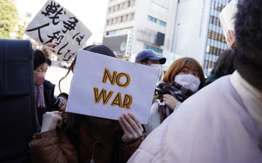 Anti-war demonstrators gather near the Russian embassy in Tokyo, Friday, Feb. 25, 2022.