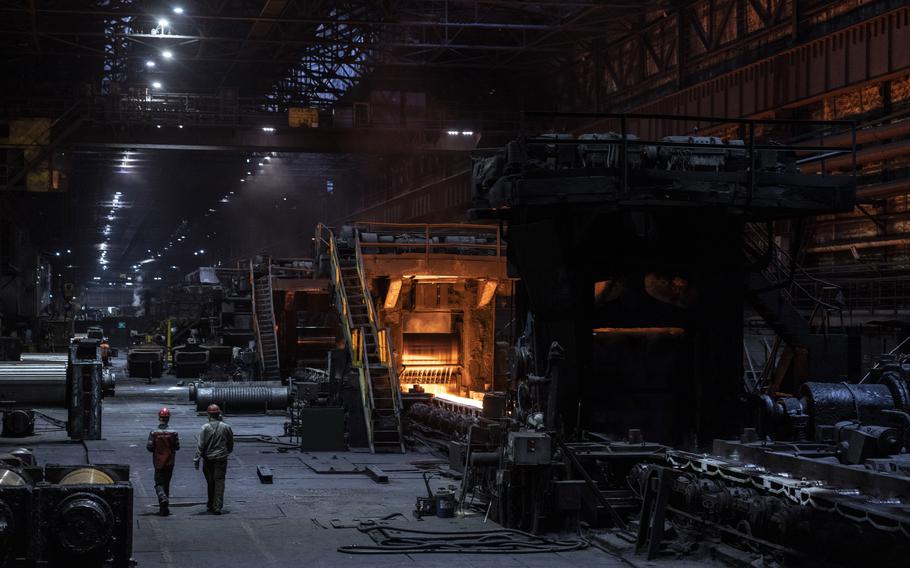A stream of molten metal moves through the production line at the Zaporizhstal steel plant in Zaporizhzhia, Ukraine, on May 29.
