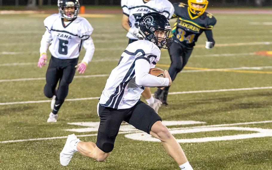 Zama quarterback Dominic Peruccio looks for running room against Edgren.