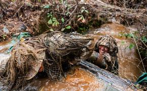 Sniper School students participate in the ghillie wash, which is designed to test the strength and durability of the suits as well as weather them. The Army is now considering whether hemp could add to the suit's camouflage priperties. 
Patrick A. Albright/U.S. Army