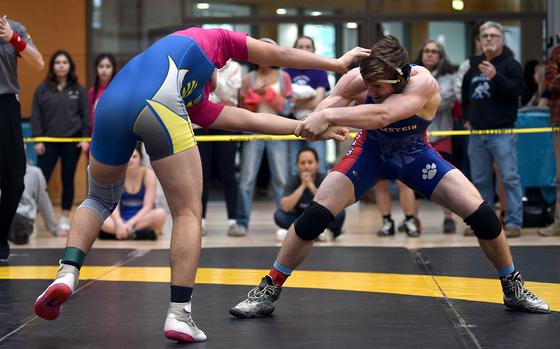 Ramstein’s Kydan Echard pulls Wiesbaden’s Wyatt Massey during a 165-pound pool-play match at the DODEA European wrestling championships on Feb. 7, 2025, in Wiesbaden, Germany.