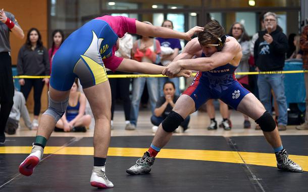 Ramstein’s Kydan Echard pulls Wiesbaden’s Wyatt Massey during a 165-pound pool-play match at the DODEA European wrestling championships on Feb. 7, 2025, in Wiesbaden, Germany.