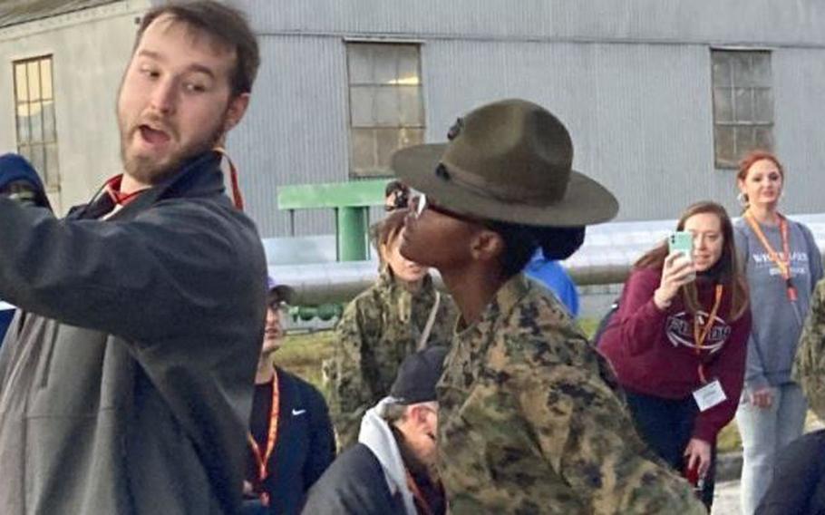 Marine Corps Sgt. Simone Dennis gives Tennesee teacher Colin Kiehlmeir a taste of a new recruit's experience at Parris Island boot camp.