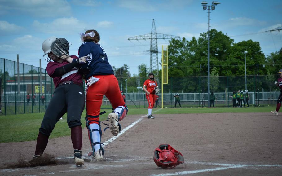 Vilseck senior Kaila Haynes collides with Lakenheath’s LaLanine Toms at home plate during the DODEA-Europe Softball Championships in Kaiserslautern, Germany, May 18, 2023.