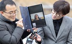 Vietnamese woman Nguyen Thi Thanh is seen on a computer monitor as she speaks outside the court at the Seoul Central District Court in Seoul, South Korea, Tuesday, Feb. 7, 2023. A South Korean court on Tuesday, Feb. 2023, ordered the government to pay 30 million won ($24,000) to a Vietnamese woman who survived a gunshot wound but lost several relatives when South Korean marines rampaged through her village during the Vietnam War in 1968. (Ryu Young-suk/Yonhap via AP)