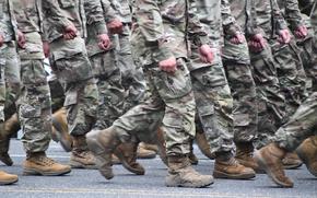 A photo of Soldiers in uniform marching.