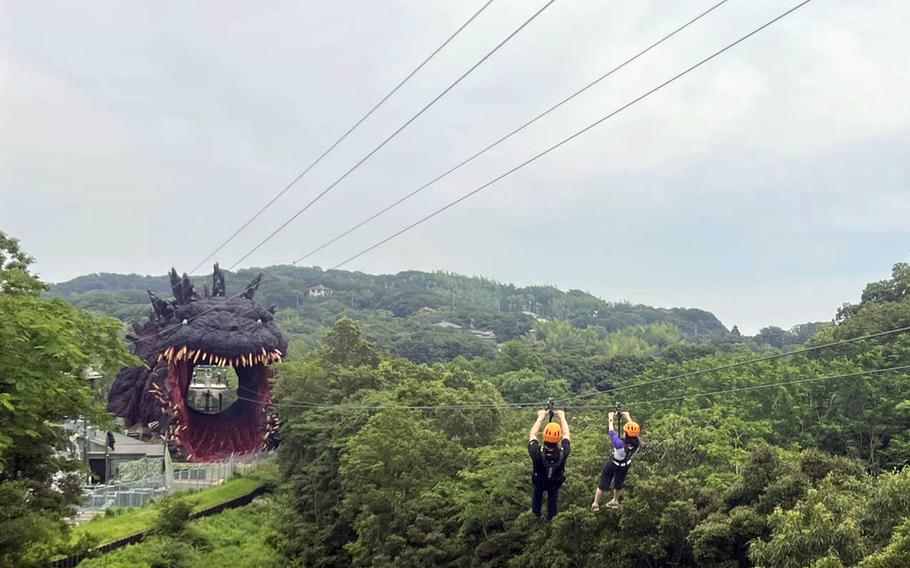 Zipliners head for Godzilla's gape at Nijigen No Mori, a theme park in Hyogo prefecture, Japan, June 21, 2023. 