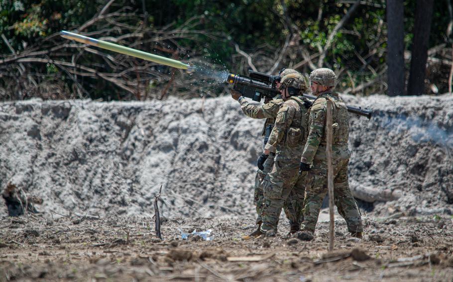 Soldiers fire a missile during an exercise.