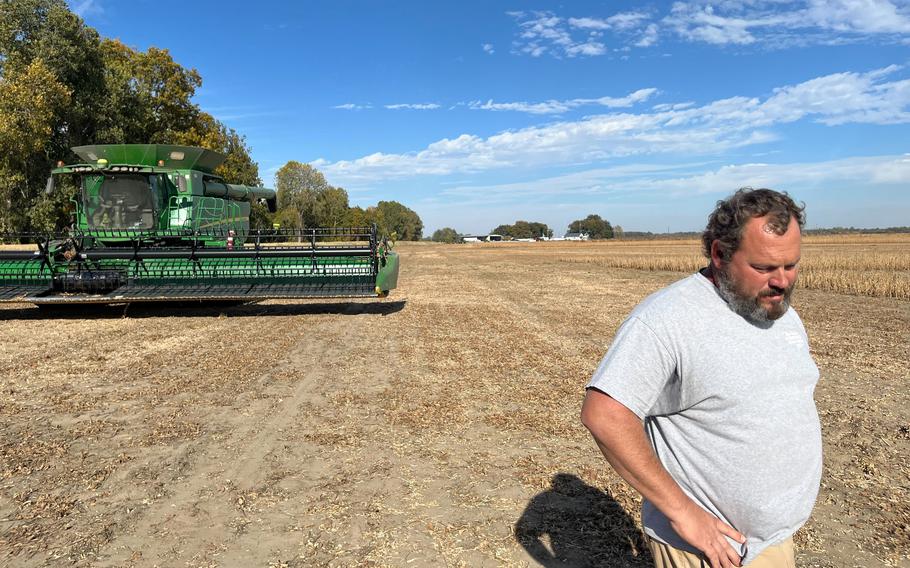 Jeremiah Hollingsworth takes a break from harvesting soybeans Oct. 24,  2022, on his family's farm near the Mississippi River in Finley, Tenn.