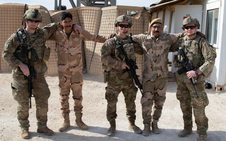 U.S. Soldiers with 1st Battalion, 5th Infantry Regiment, 1st Stryker Brigade Combat Team, 25th Infantry Division, take a photo with Iraqi troops guarding the perimeter of Al Asad Airbase in western Iraq, Feb. 15, 2020. U.S. troops regularly share food and other supplies, as well as tactics and procedures with Iraqi troops to reinforce the security partnership between the two nations. (U.S. Army photo by Sgt. Sean Harding)