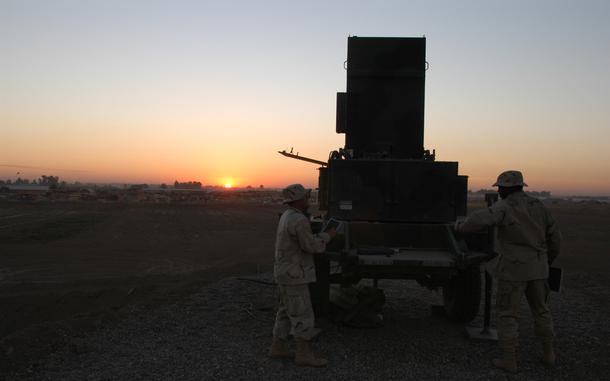 Baghdad, Iraq, Nov. 19, 2003: At Baghdad International Airport in Iraq, soldiers from the 1st Armored Division pull maintenance on part of the Firefinder radar system, which can pinpoint from where enemy mortar or artillery is being fired. Chief Warrant Officer Hipolito Medina, left, a radar section leader, and Spc. Nathaniel Rumph, a radar repairman, are both members of Battery D, 1st Battalion, 94th Field Artillery Regiment.      

META TAGS: Operation Iraqi Freedom; Wars on Terror; U.S. Army; 