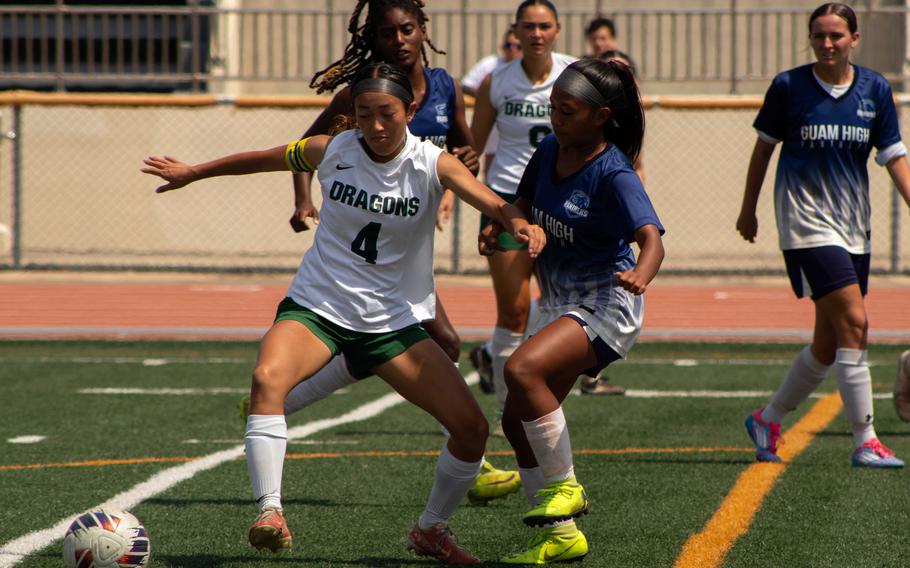 Kubasaki's Sakura Lopez and Guam High's Anaia Malaca battle for the ball.