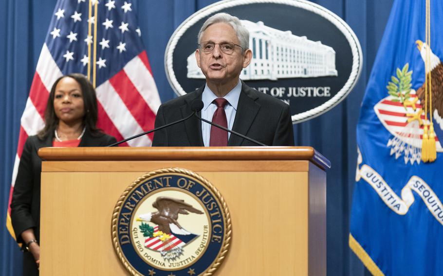 Attorney General Merrick Garland with Assistant Attorney General Kristen Clarke for the Civil Rights Division, speaks during a news conference at the Department of Justice in Washington, Thursday, Aug. 4, 2022. The U.S. Justice Department announced civil rights charges Thursday against four Louisville police officers over the drug raid that led to the death of Breonna Taylor, a Black woman whose fatal shooting contributed to the racial justice protests that rocked the U.S. in the spring and summer of 2020. 