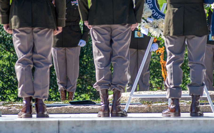 Army Green Berets stand at attention beside the John F. Kennedy Eternal Flame at Arlington National Cemetery, where a token green beret cover was placed during a wreath-laying ceremony on Wednesday, Nov. 8, 2023, to commemorate JFK’s contributions to Special Forces. The former president was assassinated six decades ago on Nov. 22, 1963.