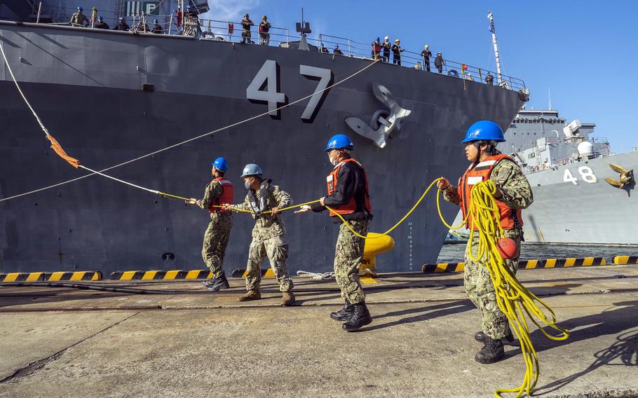 The amphibious dock landing ship USS Rushmore arrives at Sasebo Naval Base, Japan, its new homeport, Wednesday, Nov. 17, 2021. 