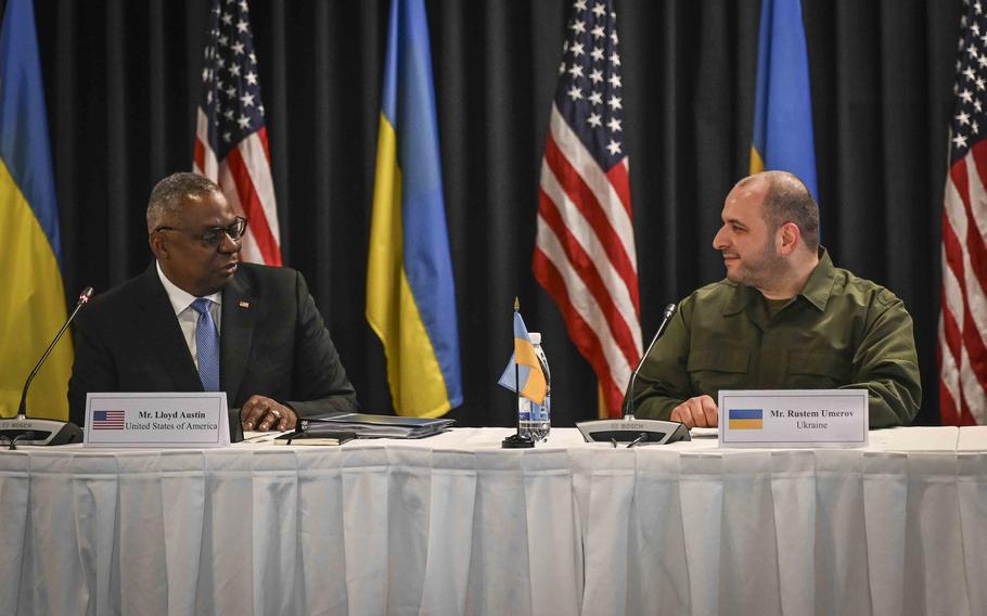 U.S. Defense Secretary Lloyd Austin greets Rustem Umerov, Ukraine's new defense secretary, during opening remarks at the Ukraine Defense Contact Group meeting Sept. 19, 2023, at Ramstein Air Base in Germany.