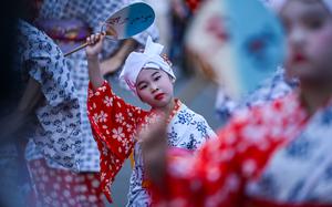 A young girl participates in the folk dance parade.