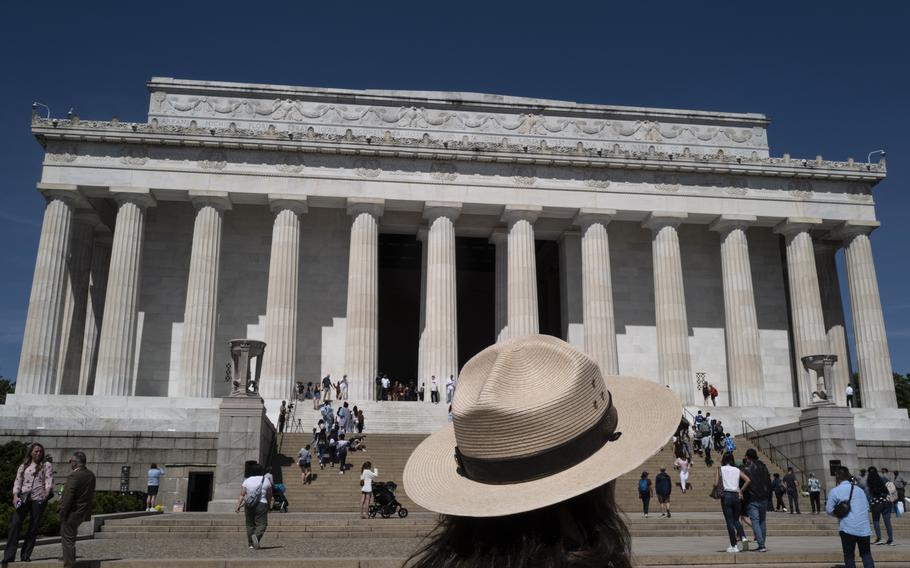 A U.S. Park Ranger stands in front of the Lincoln Memorial, which this year celebrates its 100th anniversary, on May 18, 2022, in Washington, D.C. The memorial is one of the most visited sites in the nation's capital. 