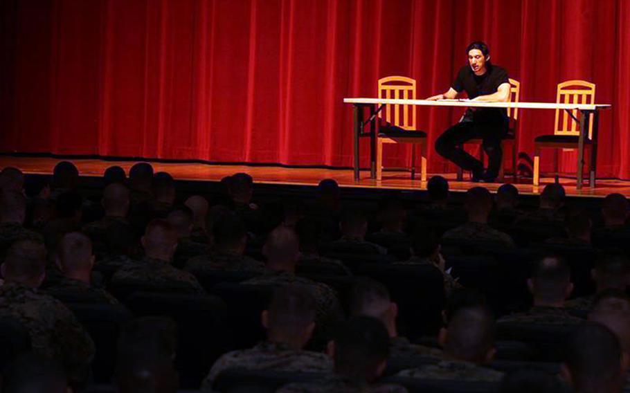 Actor and Marine veteran Adam Driver reads an excerpt from the play "Rum and Vodka" to Marines and sailors at Marine Corps Air Station Miramar, Calif., March 4, 2013.