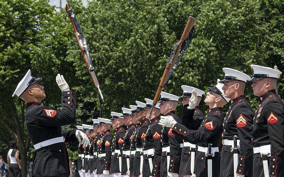 Members of a Marine Corps drill team perform outside the Lincoln Memorial on the National Mall in Washington, D.C., on Tuesday, May 31, 2022, before a crowd that included participants of a special all-female Honor Flight.