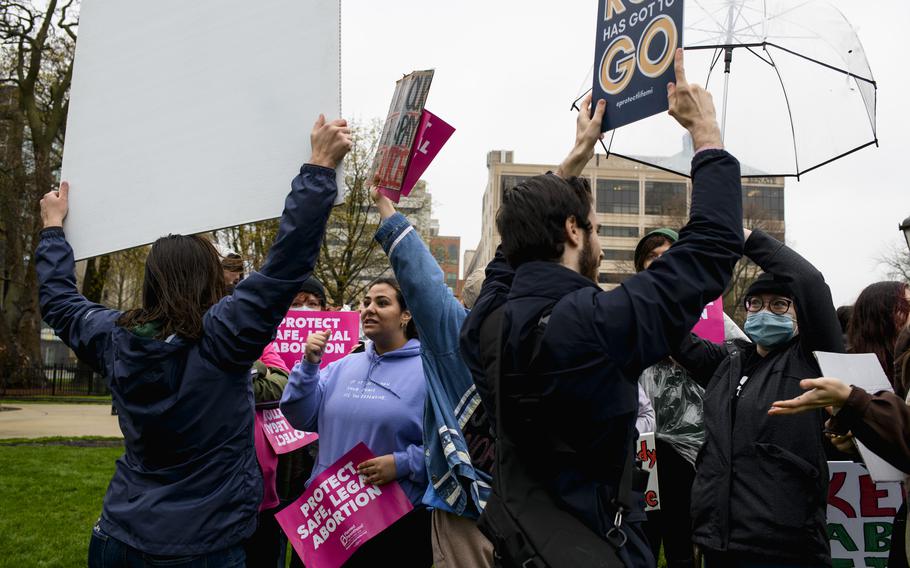 Demonstrators rallying in favor of and against abortion rights argue with one another outside of the Michigan Capitol in Lansing on Tuesday after news broke that Roe v. Wade may be struck down by the Supreme Court.