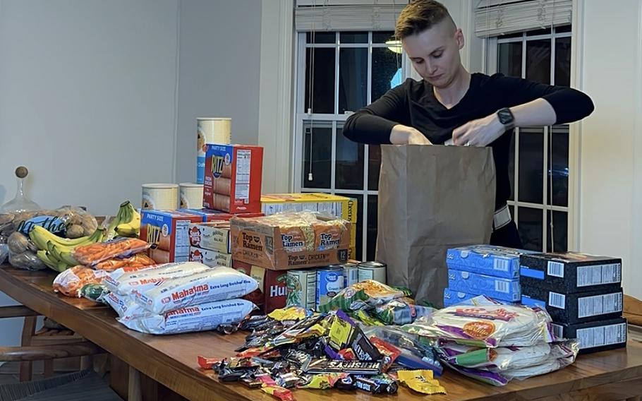 In this undated photo, military spouse and comedian Ashley Gutermuth packs up groceries for military families living on or near Joint Base McGuire-Dix-Lakehurst in New Jersey. Gutermuth and another military spouse, Heather Campbell, have initiated a grassroots campaign to help feed military families experiencing food insecurity.